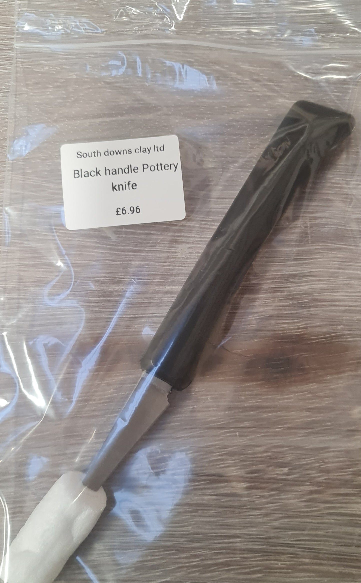 Pottery knife with black handle