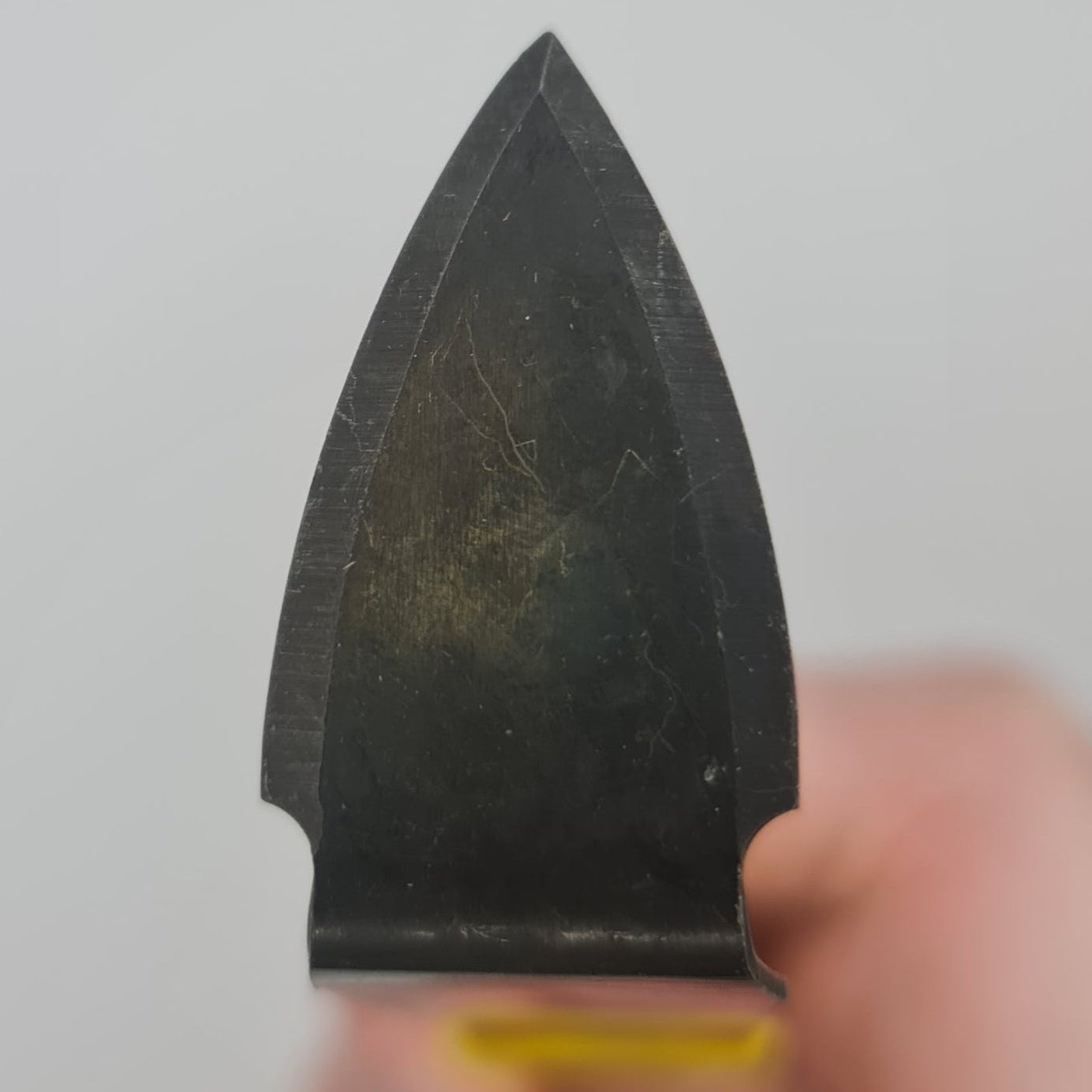 Yellow handled trimming tool for the pottery wheel.