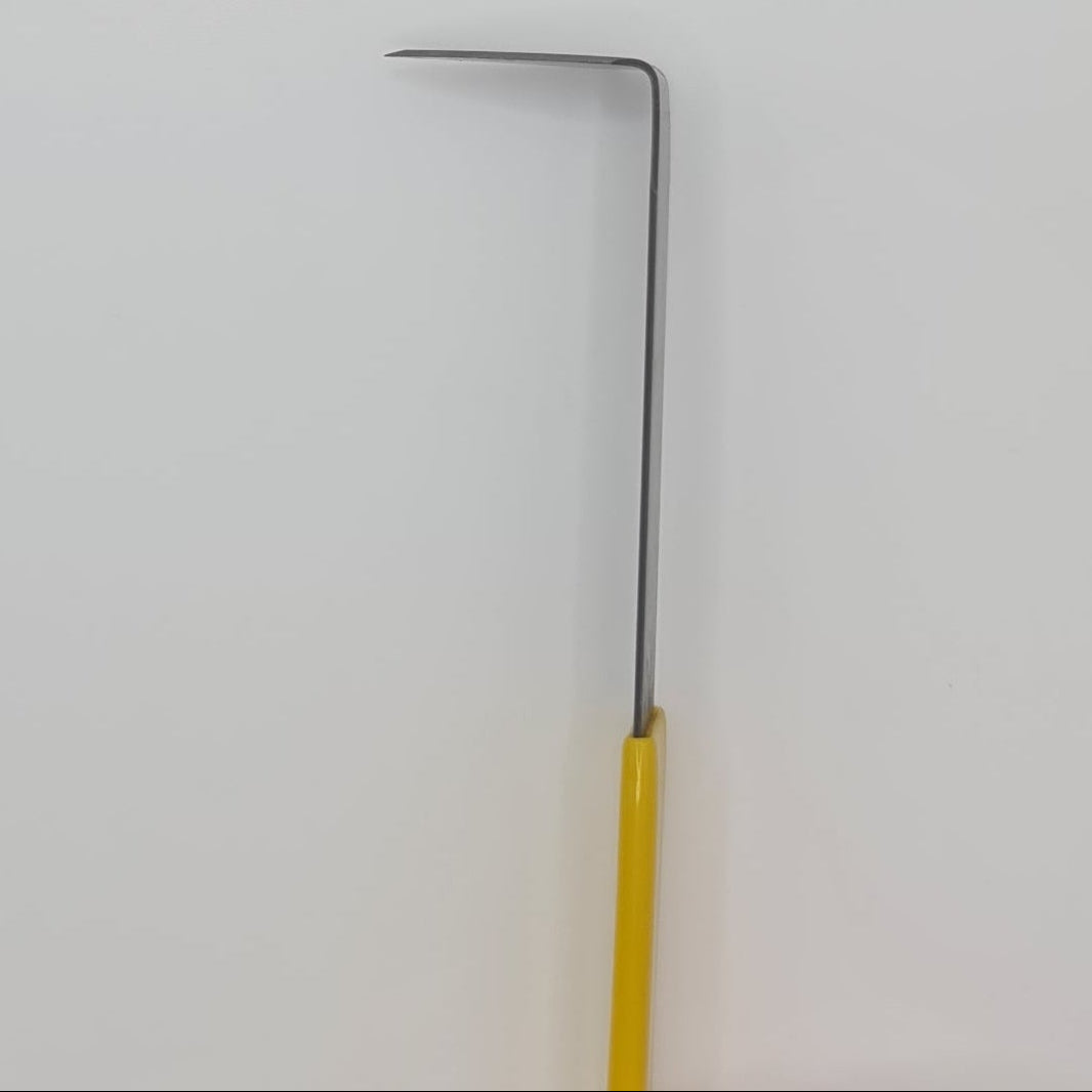 Yellow handled trimming tool for the pottery wheel.