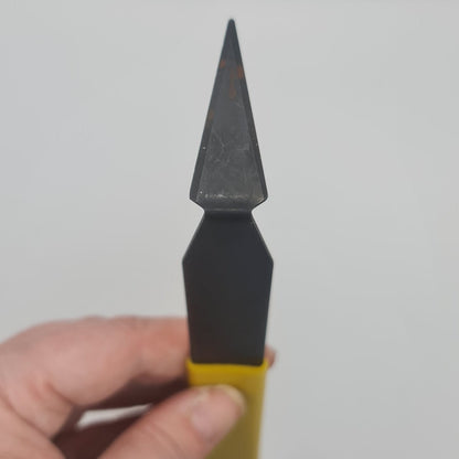 Yellow handled triangle turning tool for the pottery wheel.