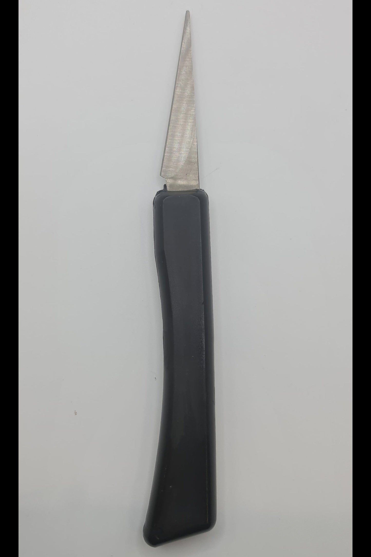 Pottery knife with black handle